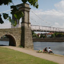 Cyclists relaxing by Trent Bridge